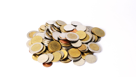 Coins stack money with close up on white backgroundの写真素材