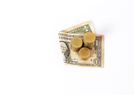 Close up for Dollar banknote and Money Coins stack On White backgroundの写真素材