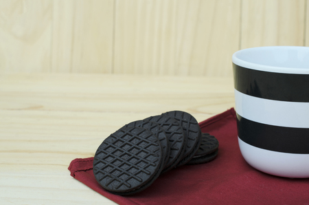 Delicious cookie with hot coffee on wooden backgroundsの写真素材