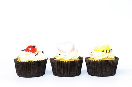 Delicious mixed cup cake for sweet and dessert food concept on white backgroundsの写真素材