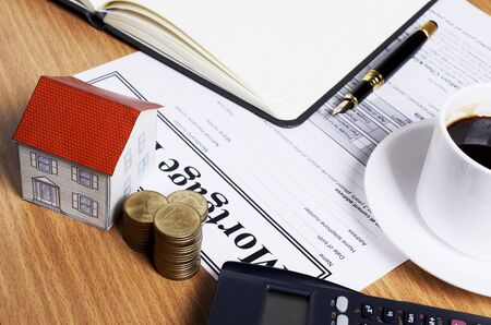House paper and money coins stack for mortgage loans conceptの写真素材