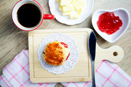 Scone homemade with hot coffee on table backgrounds above, Top viewsの写真素材