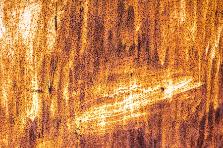 background sheet metal with rust and holesの写真素材