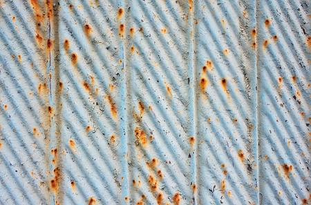 corrugated sheet steel blue with elements of rustの写真素材