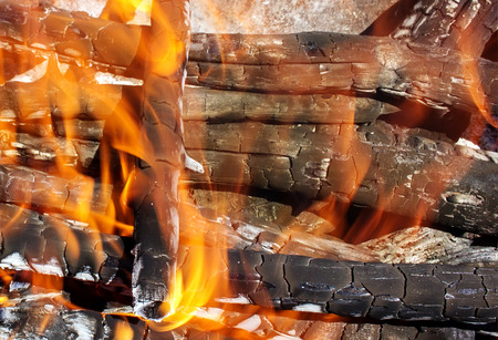 fire of wood burning bright red tongues of flameの写真素材