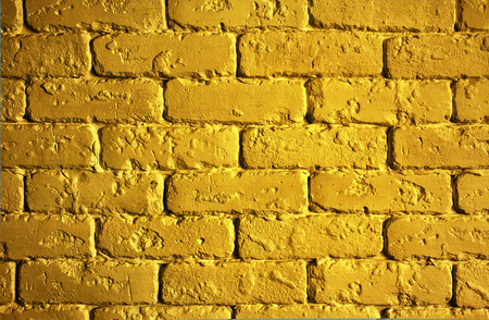 background texture gold brick wall with shimmerの写真素材