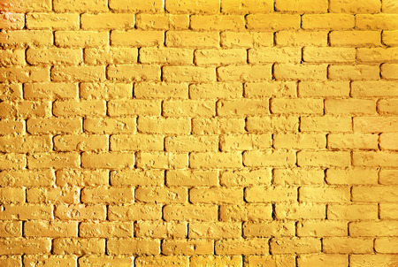background gold brick wall with shimmer textureの写真素材