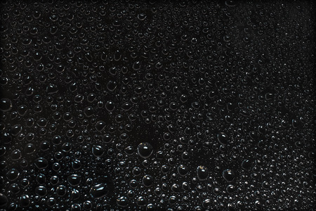 rain drops on a dark background windowの写真素材