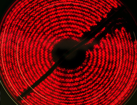Ceramic Stove Top - hot  red spiral on blackの写真素材