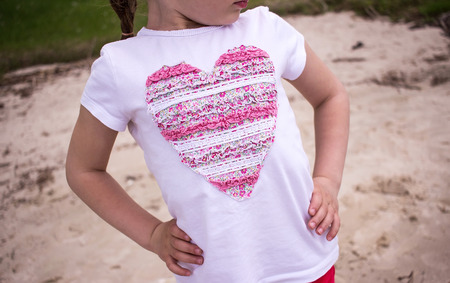 girl in a T-shirt with a beautiful insertions of flowersの写真素材