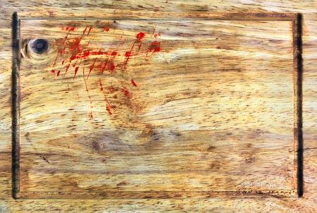 wooden cutting board with traces of blood close-upの写真素材