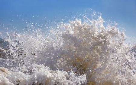 magnificent spray of sea waves with foam closeup