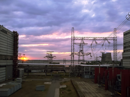 High voltage power lines at sunset on the power plant