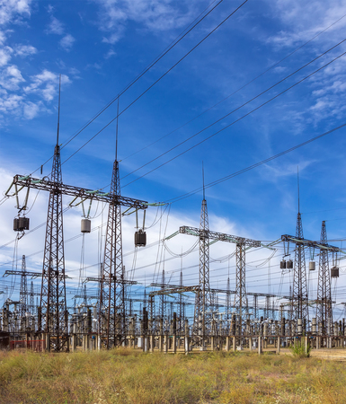 distribution electric substation with power lines on a background of the summer skyの写真素材