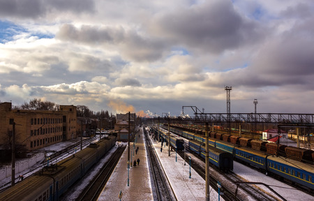 railway station with passenger and freight trains on a background of storm clouds. view from above. industrial landscapeのeditorial素材