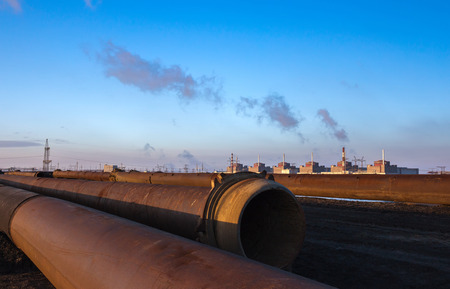 Nuclear energy and pollution. huge plant and pipes at sunset.のeditorial素材