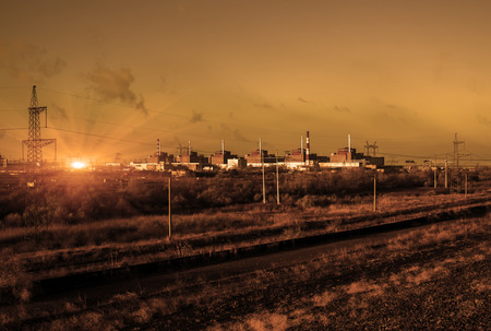 Nuclear energy and pollution. Nuclear Power Station in sepia color.のeditorial素材