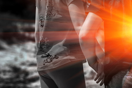 guy holding the girl's hand. romantic scene at sunset. colorless picture.の写真素材