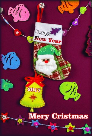 handmade card "Merry Cristmas". New Year's stocking with funny Santa Clausの写真素材