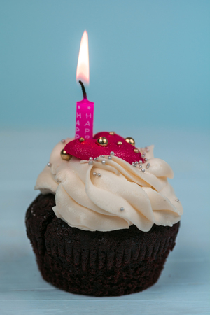 Cupcakes for Valentine's Day. Birthday cupcake with candle. cakes with a heart.の写真素材