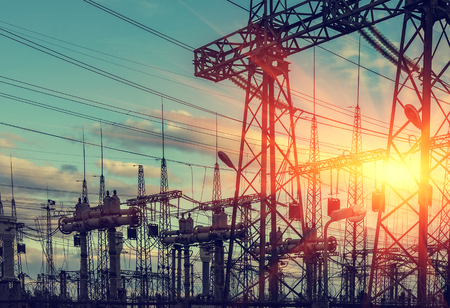  high-voltage  power lines at sunset. electricity distribution station . high voltage electric transmission tower. の写真素材