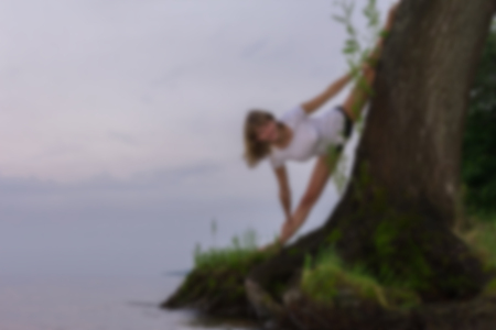 Silhouette of a girl yoga on the beach. Athlete gymnast . Motivation background.の写真素材