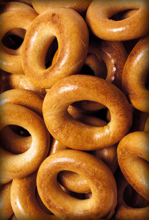 placer rosy delicious bagels forming image on a black backgroundの写真素材