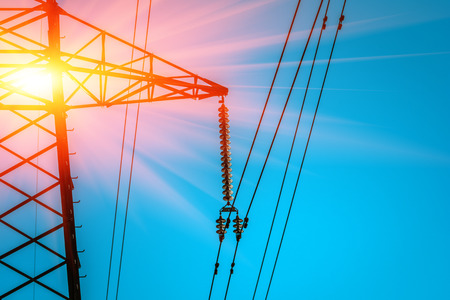  high-voltage  power lines at sunset. electricity distribution station .の写真素材