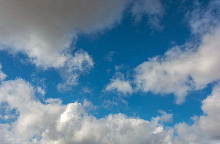 Voluminous clouds on a blue summer sky  at sunset.  beautiful sky.の写真素材