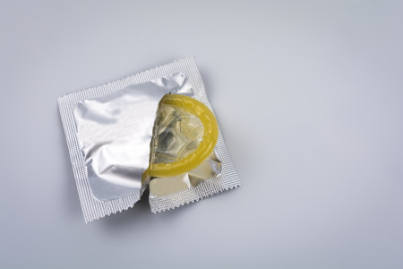 Condom close-up isolated. Contraceptive protection from pregnancy, AIDS.の写真素材