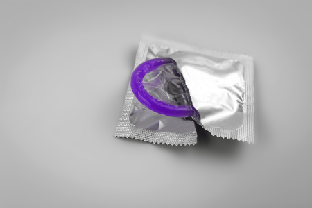 Condom close-up isolated. Contraceptive protection from pregnancy, AIDS.の写真素材