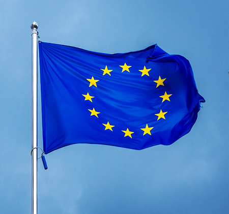 The flag of the European Union , against the background of the sunny sky. State symbols, politics.の写真素材