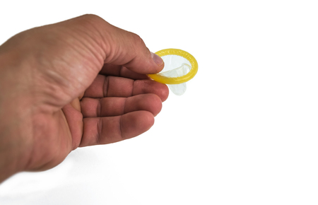 Condom close-up isolated. Contraceptive protection from pregnancy, AIDS.の写真素材