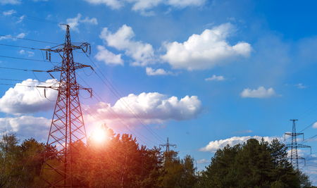  high-voltage  power lines at sunset. electricity distribution station. high voltage electric transmission tower. の写真素材