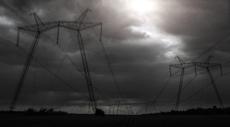 high-voltage  power lines at sunset. electricity distribution station. high voltage electric transmission tower.の写真素材