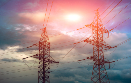 high-voltage  power lines at sunset. electricity distribution station. high voltage electric...