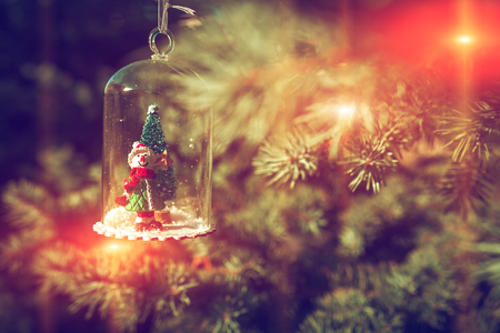 New Year and Christmas snowman at sunset, fabulous picture on a blurred background.の写真素材