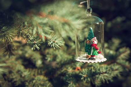 New Year and Christmas snowman at sunset, fabulous picture on a blurred background.の写真素材