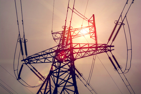 high-voltage  power lines at sunset. electricity distribution station. high voltage electric transmission tower.の写真素材