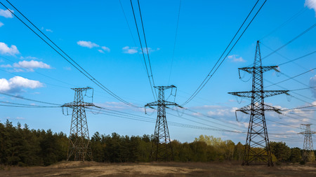 high-voltage  power lines at  clouds in the forest. electricity distribution station. high voltage electric transmission tower.の写真素材