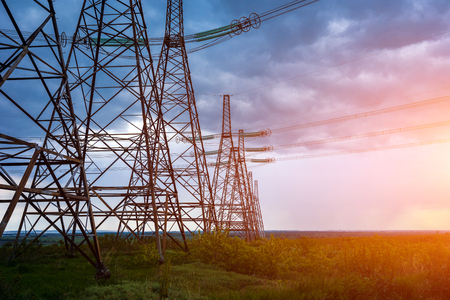high-voltage  power lines at sunset. electricity distribution station. high voltage electric transmission tower.の写真素材
