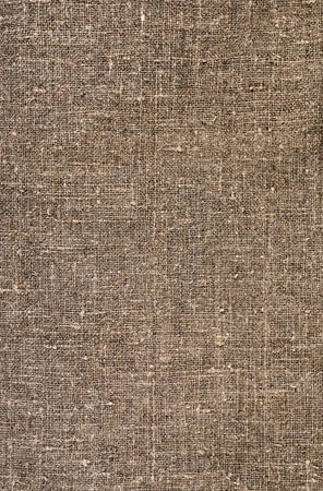 Burlap close-up, natural coarse cloth, tablecloth with foldsの写真素材