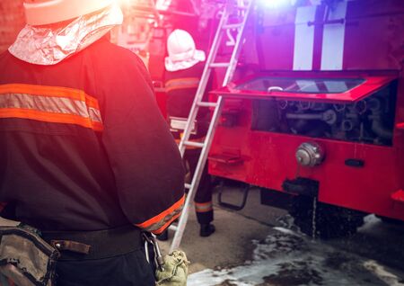 fire truck to put out a  fire. firefighters to extinguish the fire.の写真素材