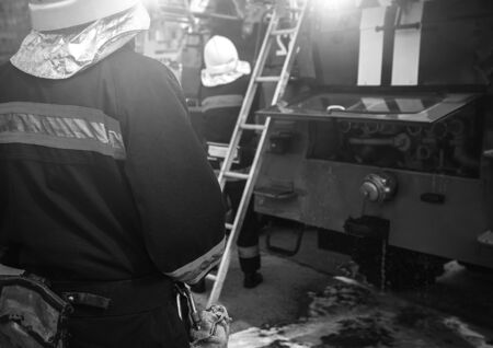 fire truck to put out a  fire. firefighters to extinguish the fire.の写真素材