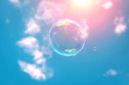 soap bubbles into the sunset with beautiful bokehの写真素材