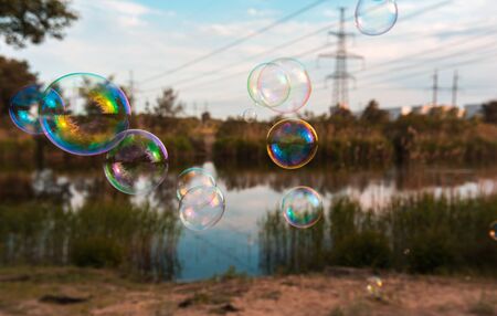 soap bubbles into the sunset with beautiful bokehの写真素材