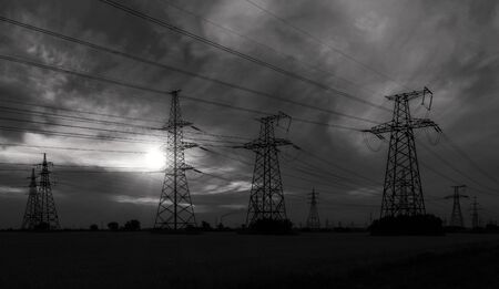 high-voltage  power lines at sunset. electricity distribution station. high voltage electric transmission tower. の写真素材