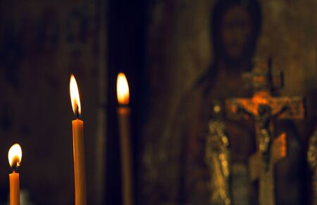 Christmas. religion postcard with new year. Jesus on a background of candles.