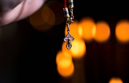 Christening in the church. Catholicism and Orthodoxy, faith. candle on a blurred background.