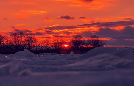 texture of the ice surface with bubbles at sunset. abstract winter background.の写真素材